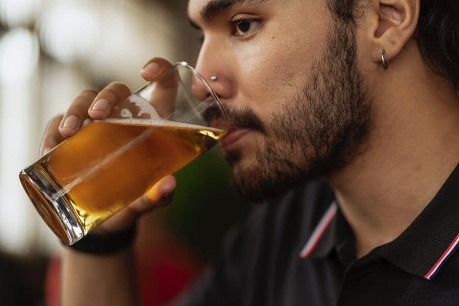 Man drinking a glass of beer