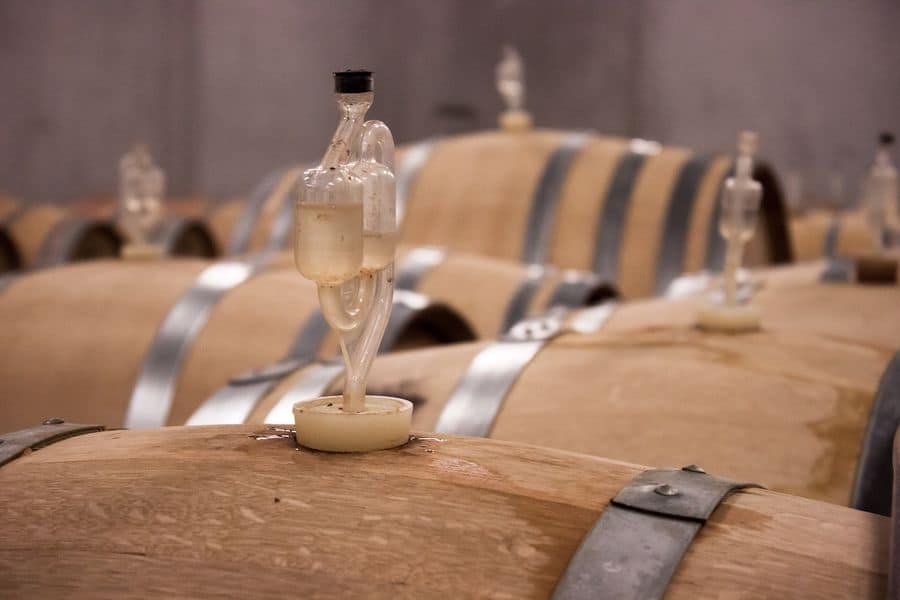 Wine barrels with an attached airlock bubbler