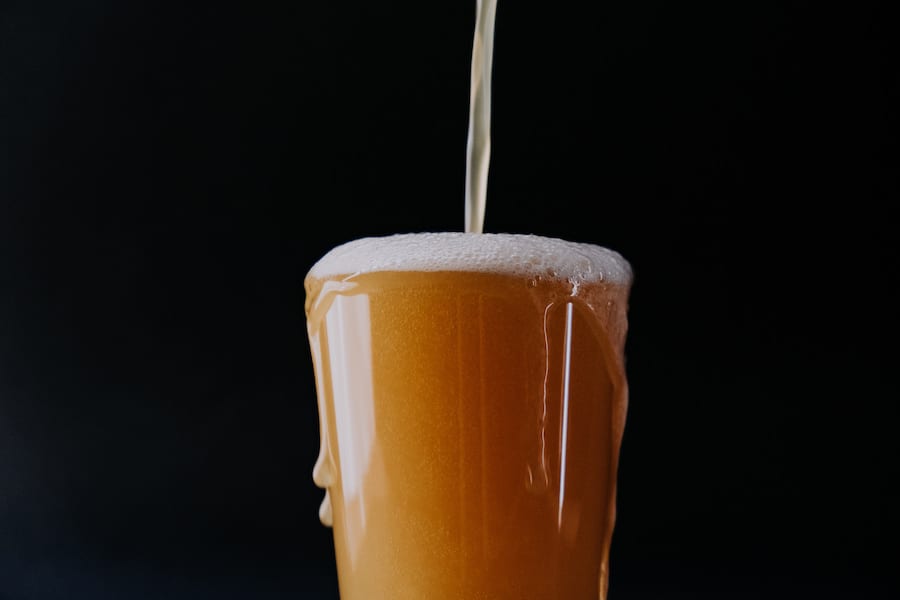 A beer being poured in a glass