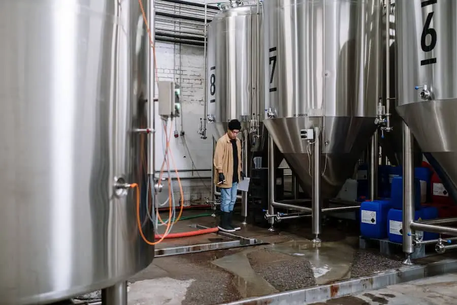 A man standing inside a brewery