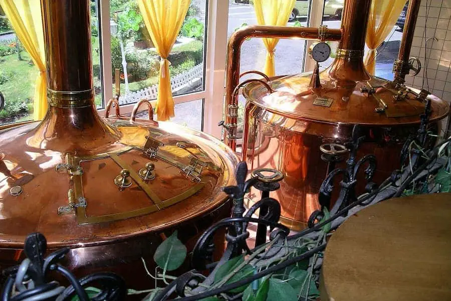A rose gold colored conical fermenter