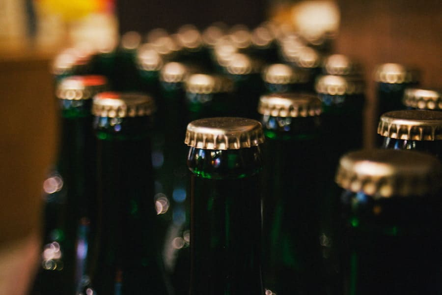 An image of beer bottles with caps