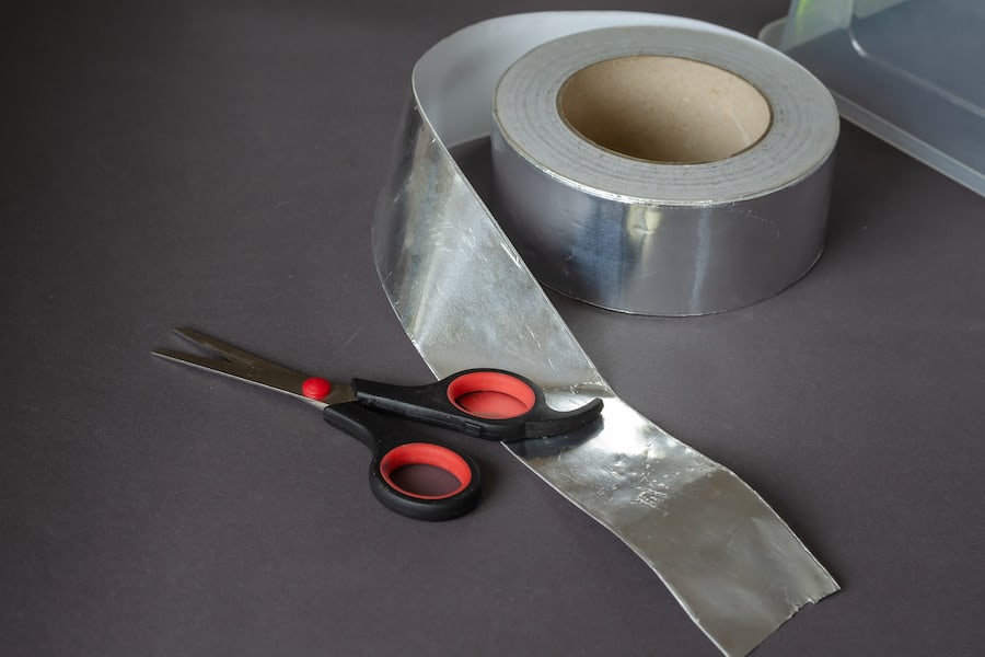 An image of aluminum tape with scissors