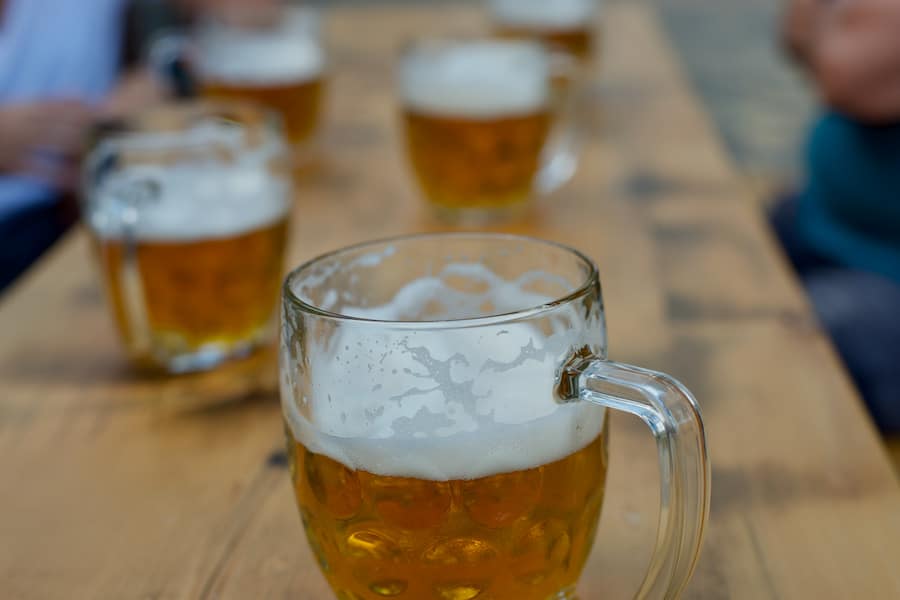 A close-up image of a glass of beer