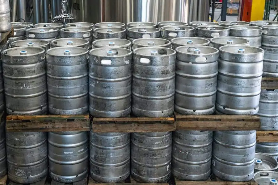 An image of kegs that are stacked up together