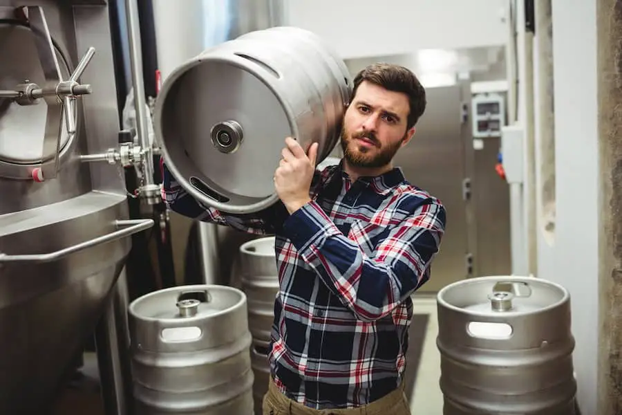 An image of a person showing how to store a keg