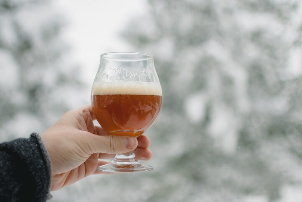 An image of a person holding a homebrew beer