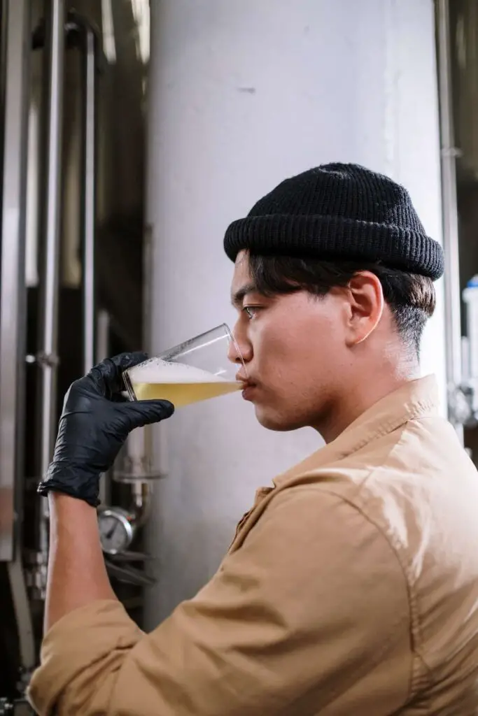 An image of a man tasting beer