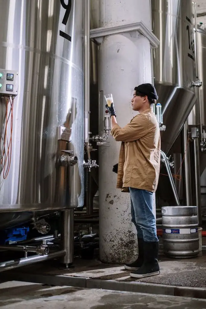 Man checking the quality of his beer