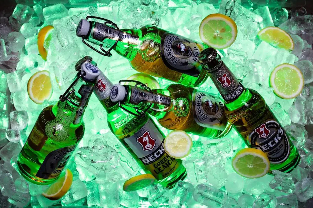 Five bottles of Beck's beer were placed on an ice chest with lemon