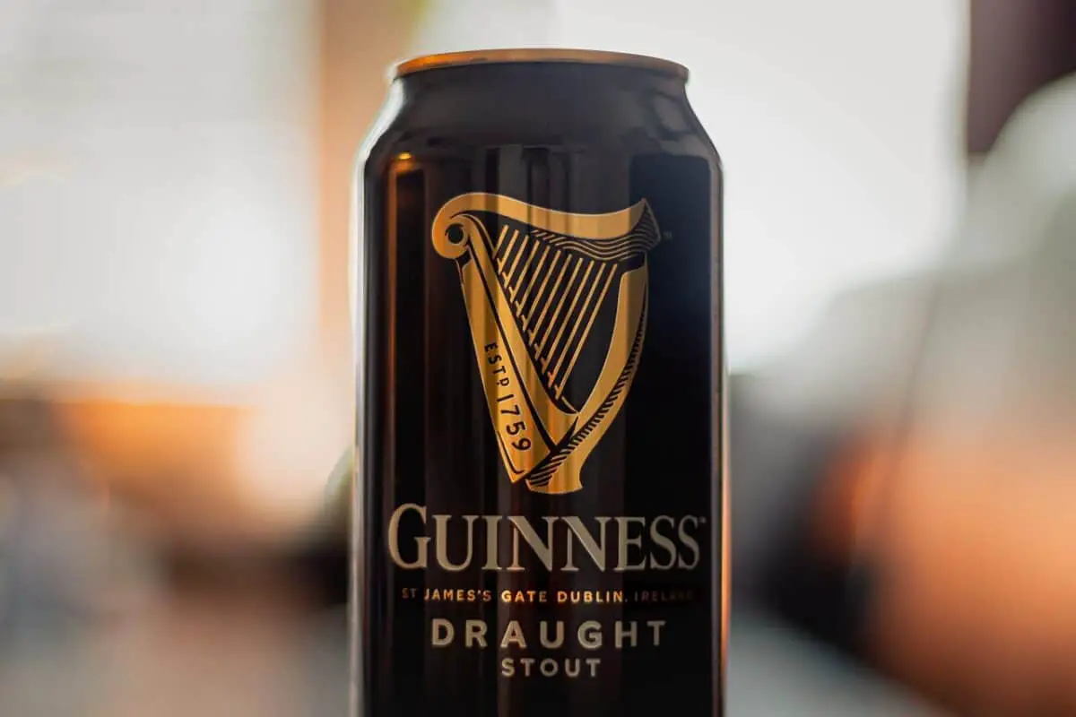 A close-up view of a tin can of Guinness Draught Stout